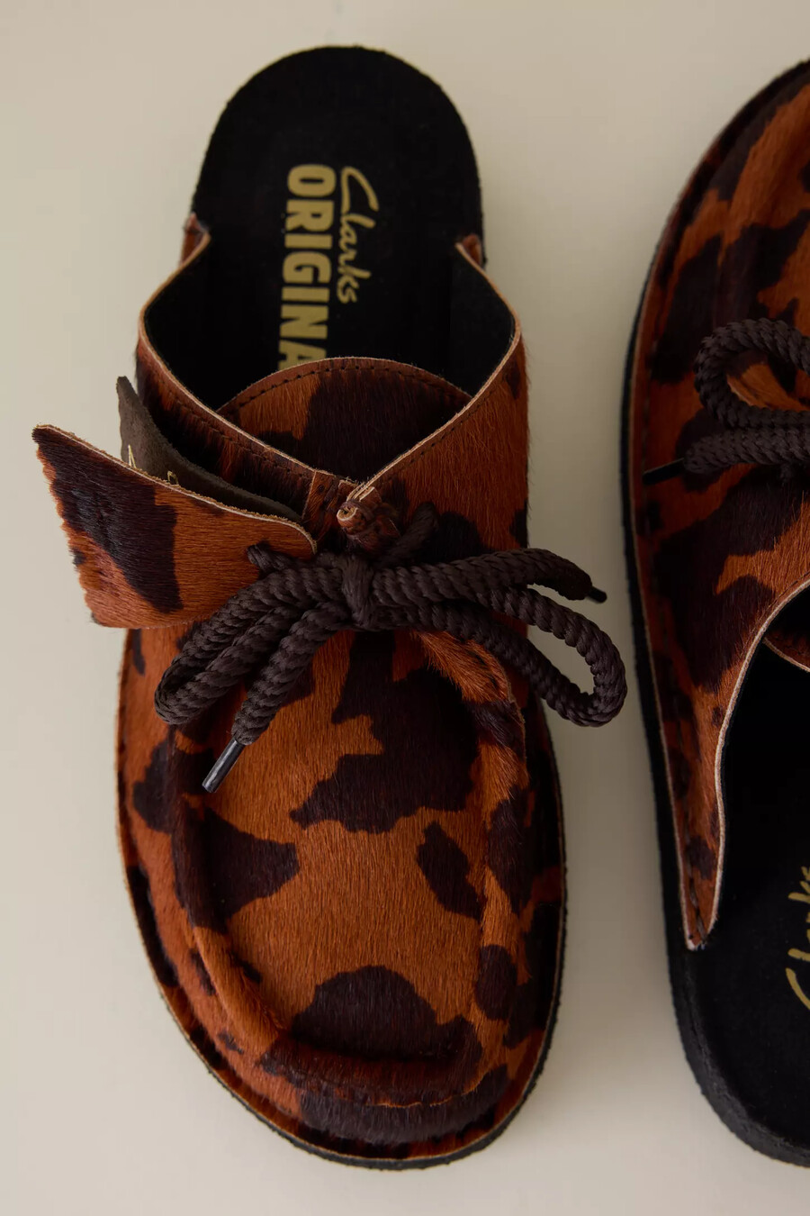clarks desert nomad cow print mule