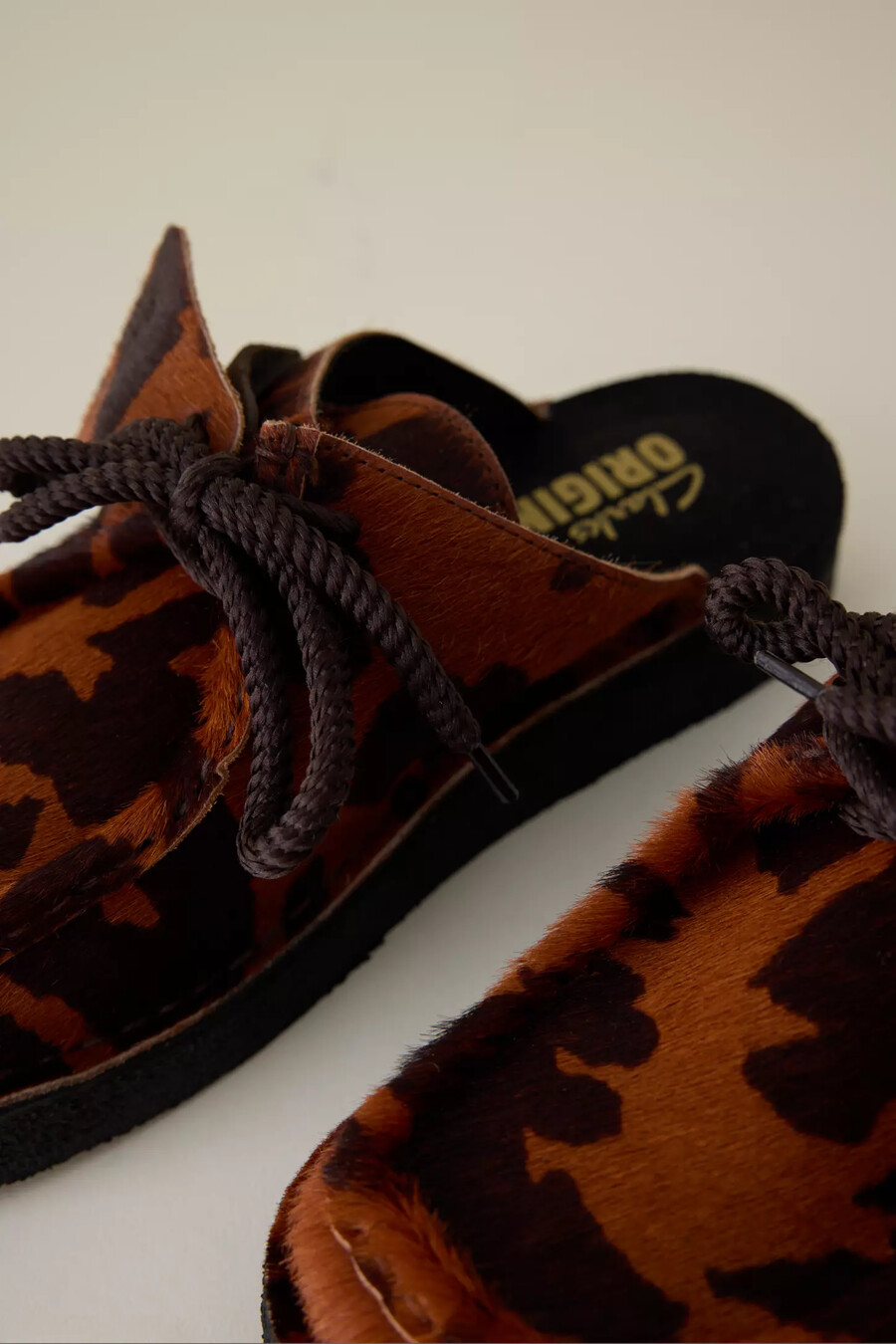 clarks desert nomad cow print mule