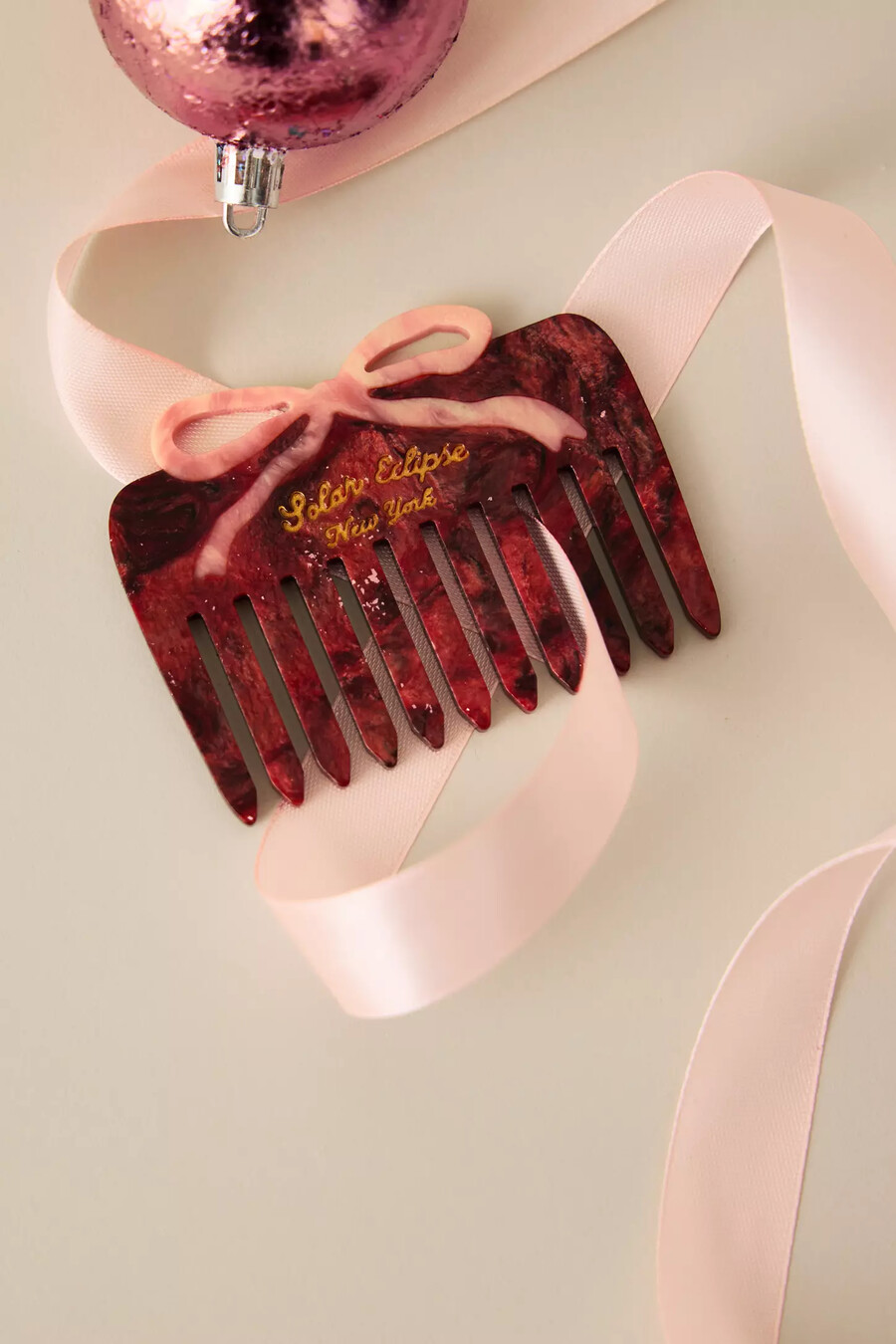 solar eclipse red bow comb