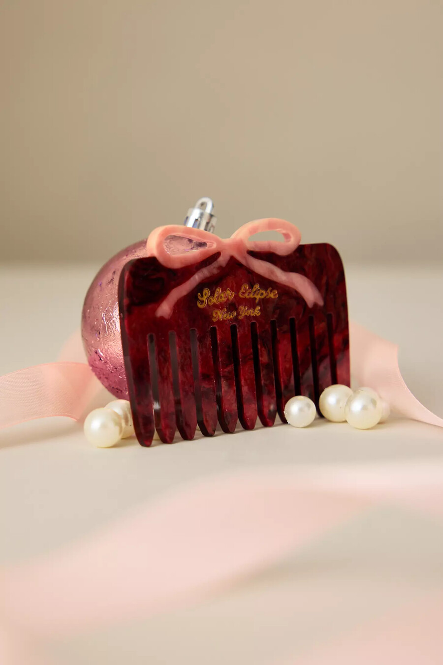 solar eclipse red bow comb