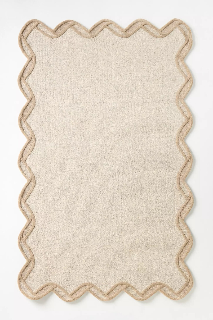 tufted wool scalloped border rug